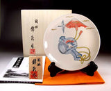 Fujii Kinsai Arita Japan - Ironabeshima Mount Fuji, Cranes, and Mallet of Good Fortune (Auspicious Patterns)  Ornamental plate 19.00 cm   吉祥文様 色鍋島様式小槌鶴富士山絵飾り皿（径１９ｃｍ）   - Free Shipping